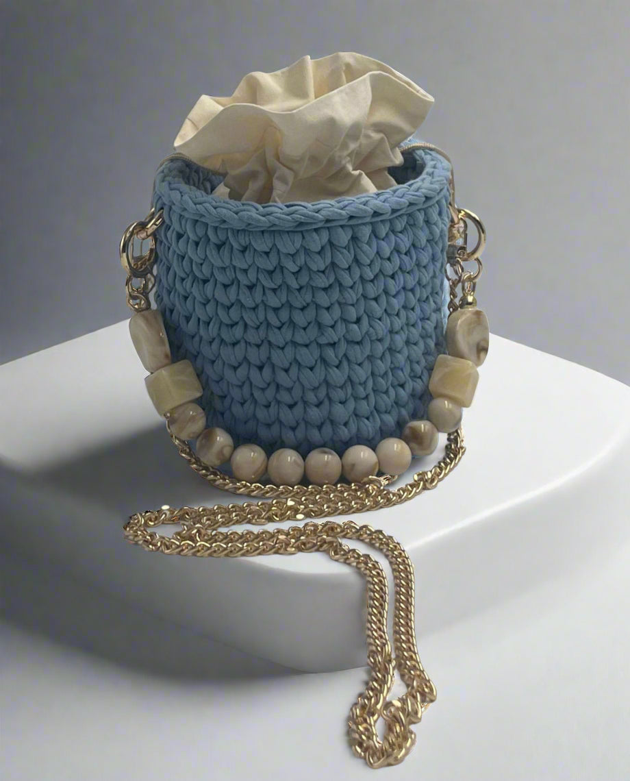 Handmade mini shoulder bag in baby blue, crafted from recycled cotton yarn – eco-friendly and charming accessory